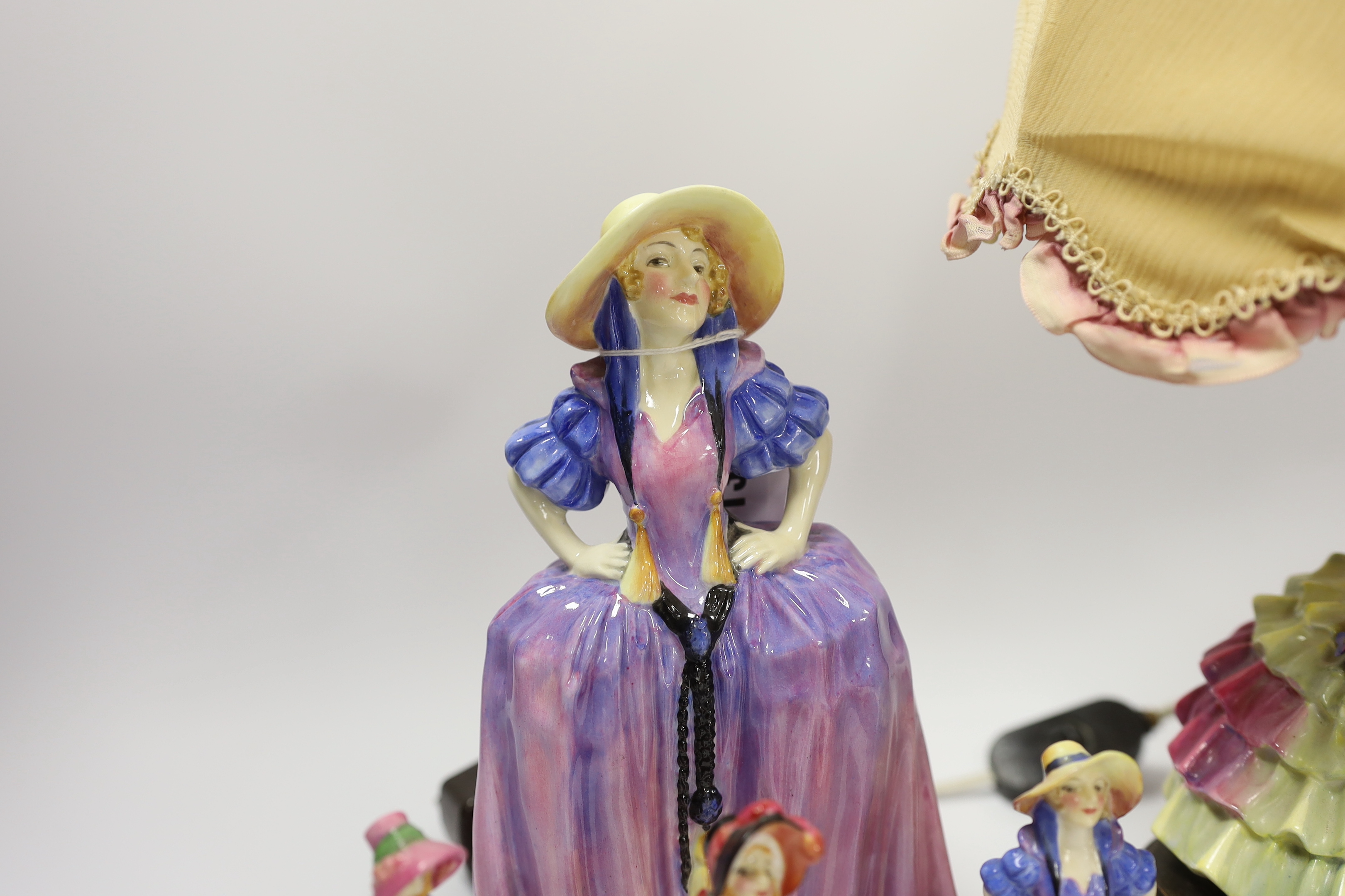 Six Royal Doulton figurines comprising two Patricia HN1431 (one miniature), miniature Pantalettes, The Paisley Shawl and Sweet Anne together with Chloe HN1470, mounted as a lamp